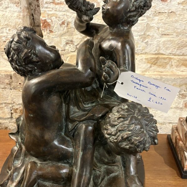 Beautiful, large, bronze centrepiece featuring 3 putti holding  a “horn of plenty “ French circa 1860.
